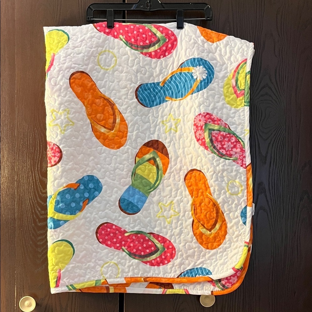 No brand white quilted flip flop blanket. White with different color flip flops